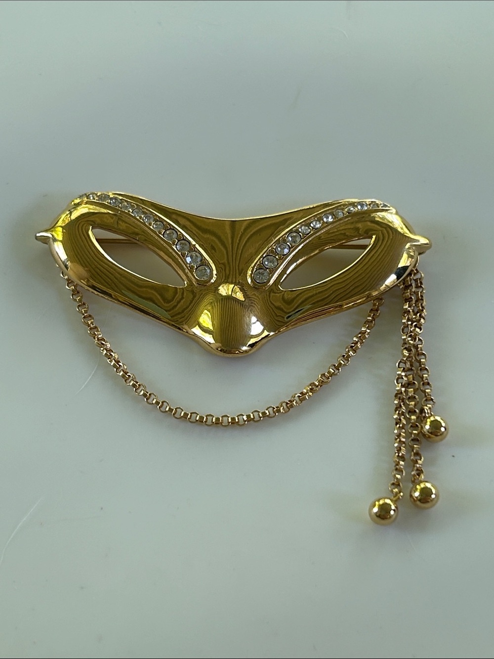Vintage Monet Gold Tone Masquerade Mask Brooch with Rhinestones & Tassel Chains